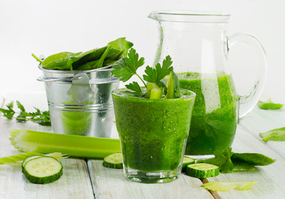 Healthy green smoothie in a glass.  Selective focus